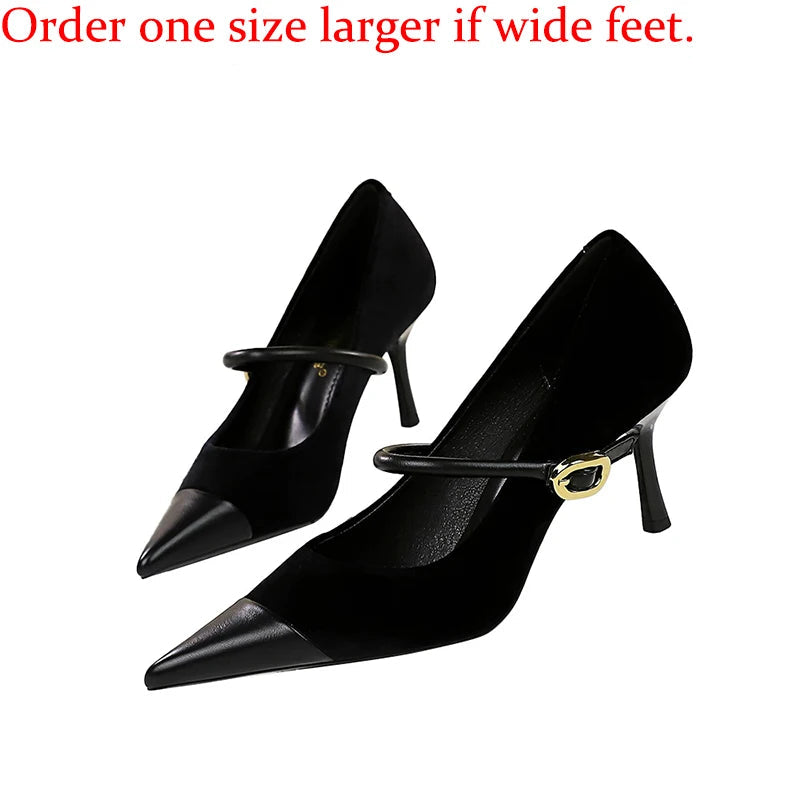 Black high-heeled shoes with a gold buckle on a white background, accompanied by text advising to order one size larger for wide feet.