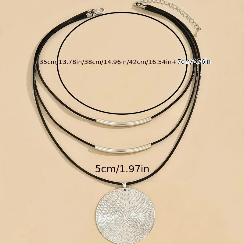 Bohemian leather necklace with rope chain construction and artisanal design