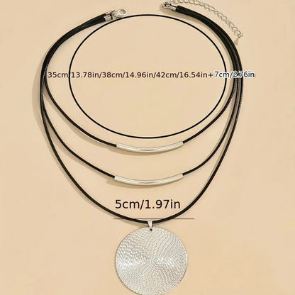 Bohemian leather necklace with rope chain construction and artisanal design