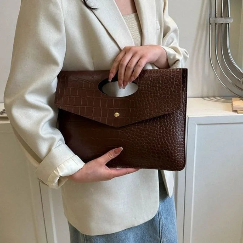 Coffee-colored Bold Envelope Evening Clutch with textured PU exterior and distinctive oval handhold.