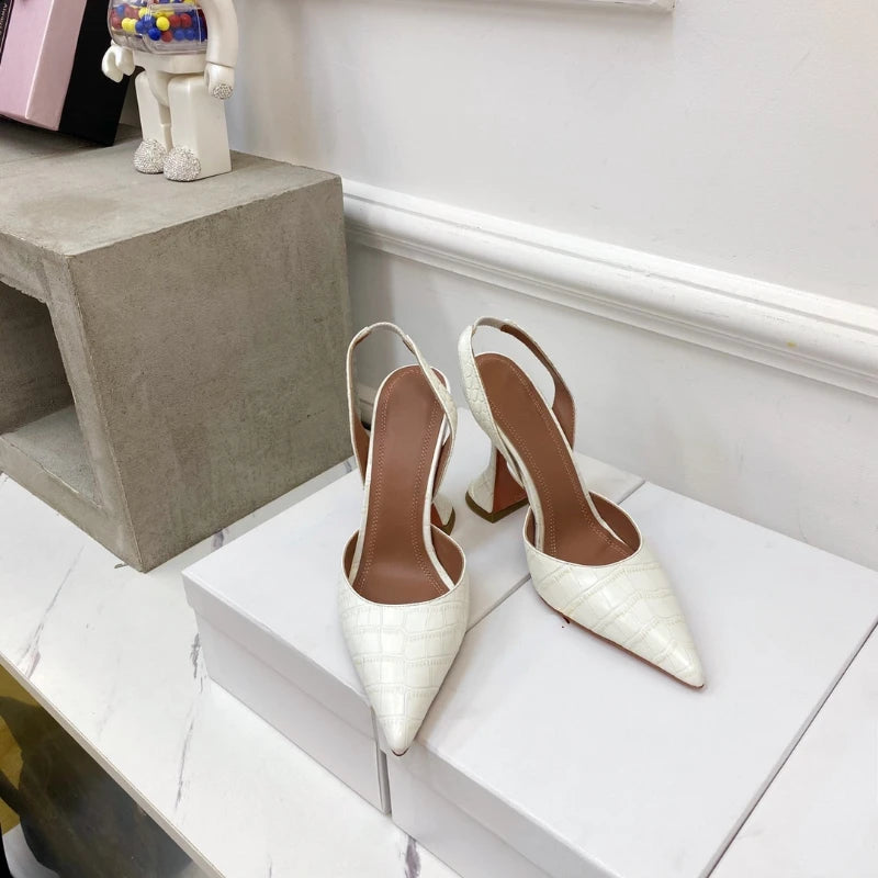 Close-up of crocodile texture on elegant stiletto heels showing luxury detail