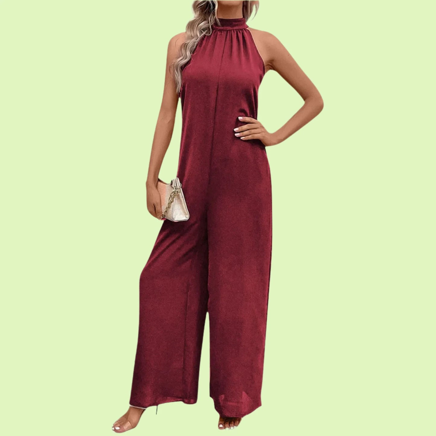 Elegant sleeveless jumpsuit for women in burgundy with halter neckline.