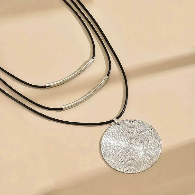 Genuine leather necklace displaying minimalist design and natural brown leather texture