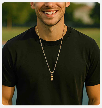 Men's arrow spike pendant necklace with full-length silver box chain on marble surface