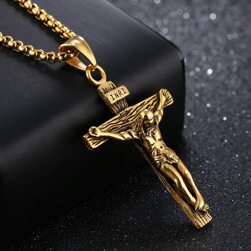 Gold crucifix pendant on a black background