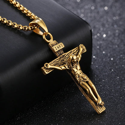 Gold crucifix pendant on a black background