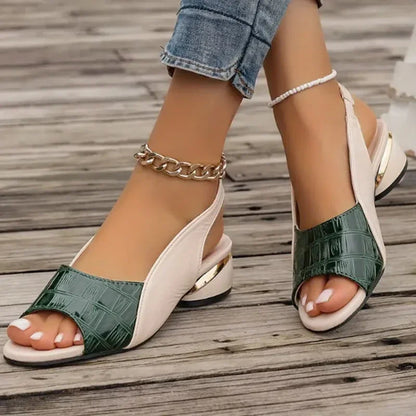 Green open-toe mid-heel sandals with a crocodile-textured finish.