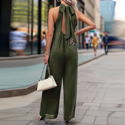 Chic wide-leg jumpsuit in olive green styled with heels.