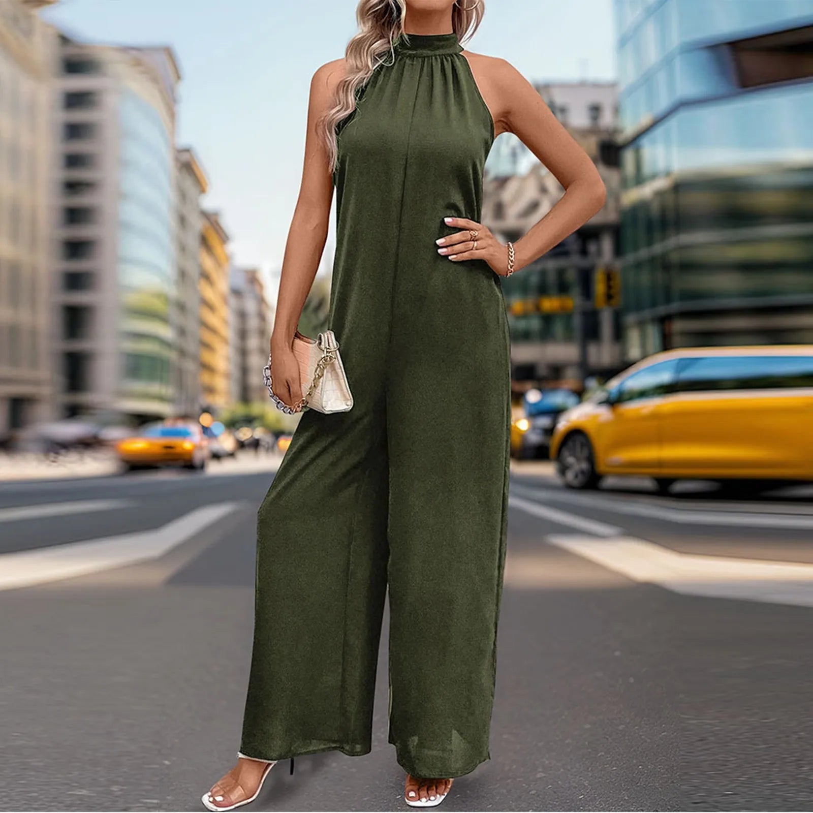 Chic wide-leg jumpsuit in olive green styled with heels.