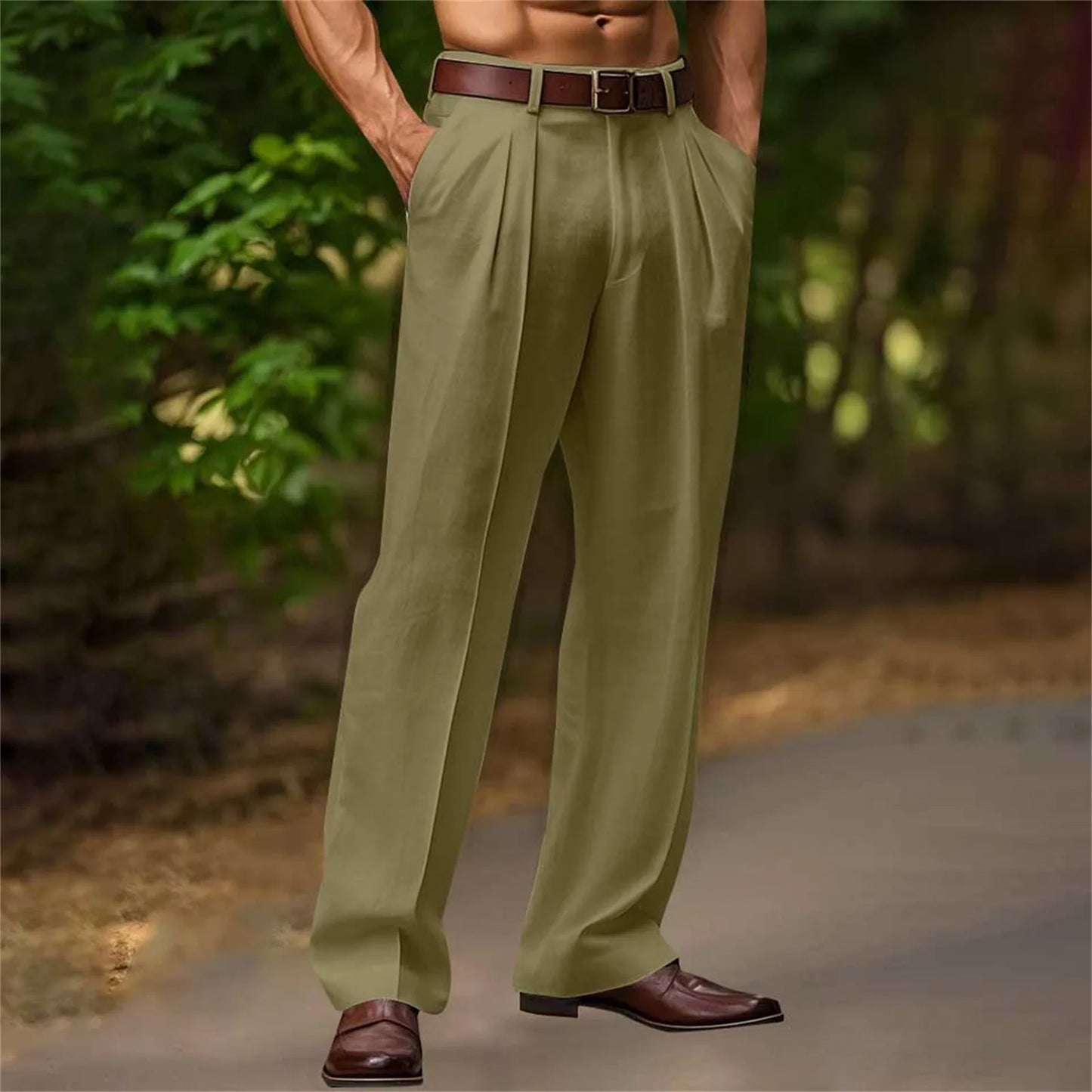 Person wearing green pleated pants with a brown belt and shoes, standing outdoors.
