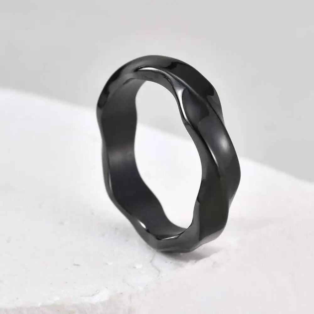 Dark matte men's wave ring — closeup of oxidized finish texture