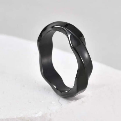 Dark matte men's wave ring — closeup of oxidized finish texture