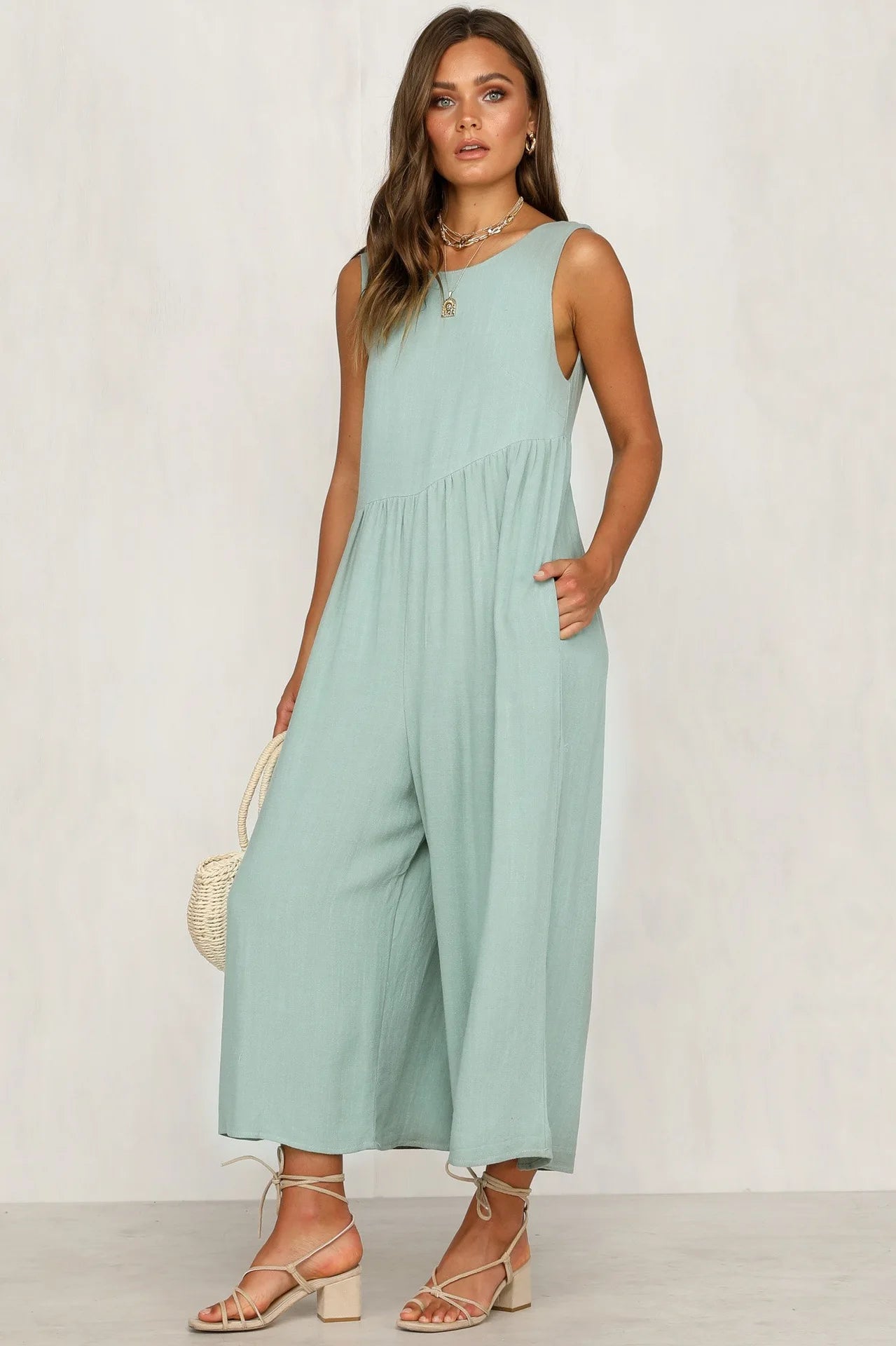 Elegant V-back jumpsuit in olive green.