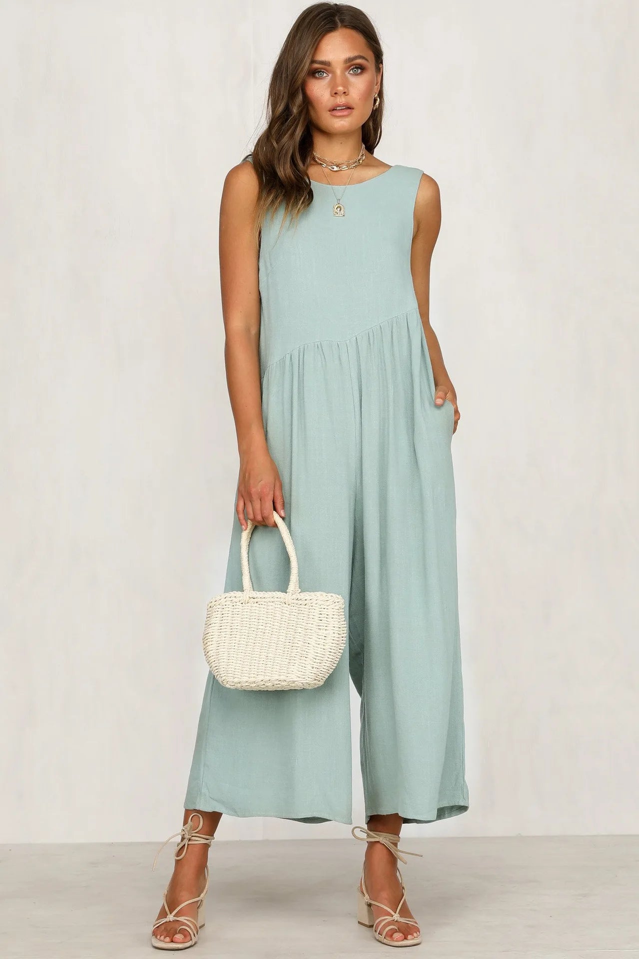 Trendy sleeveless jumpsuit for women in mint green.