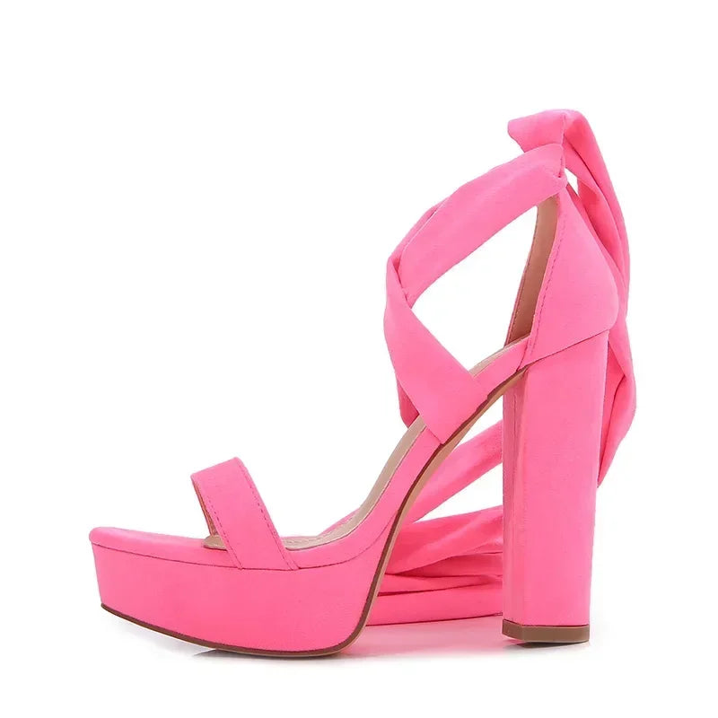 Pink lace-up sandals for summer chic.