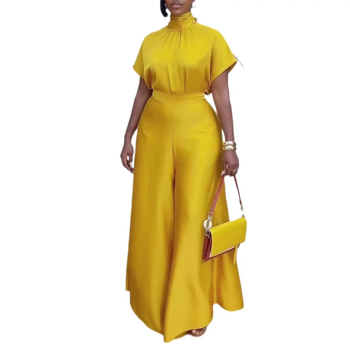 "Yellow two piece set featuring wide-leg pants and short sleeve mock neck top on model"