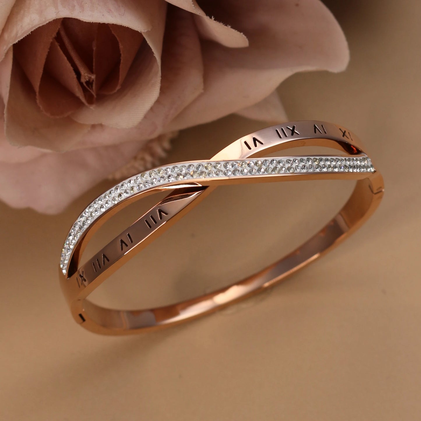 Woman wearing rose gold crystal bangle bracelet with elegant outfit