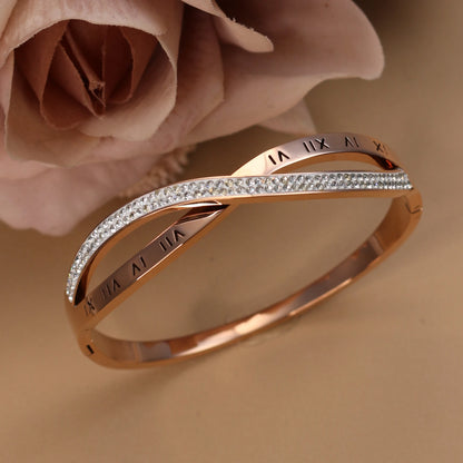 Woman wearing rose gold crystal bangle bracelet with elegant outfit