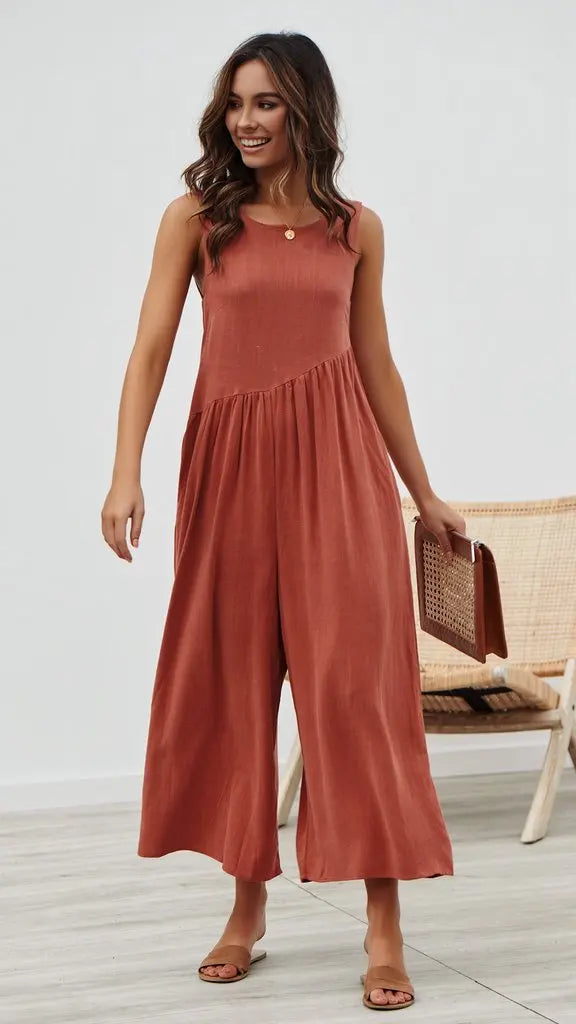 Rust-colored jumpsuit styled for casual outings.