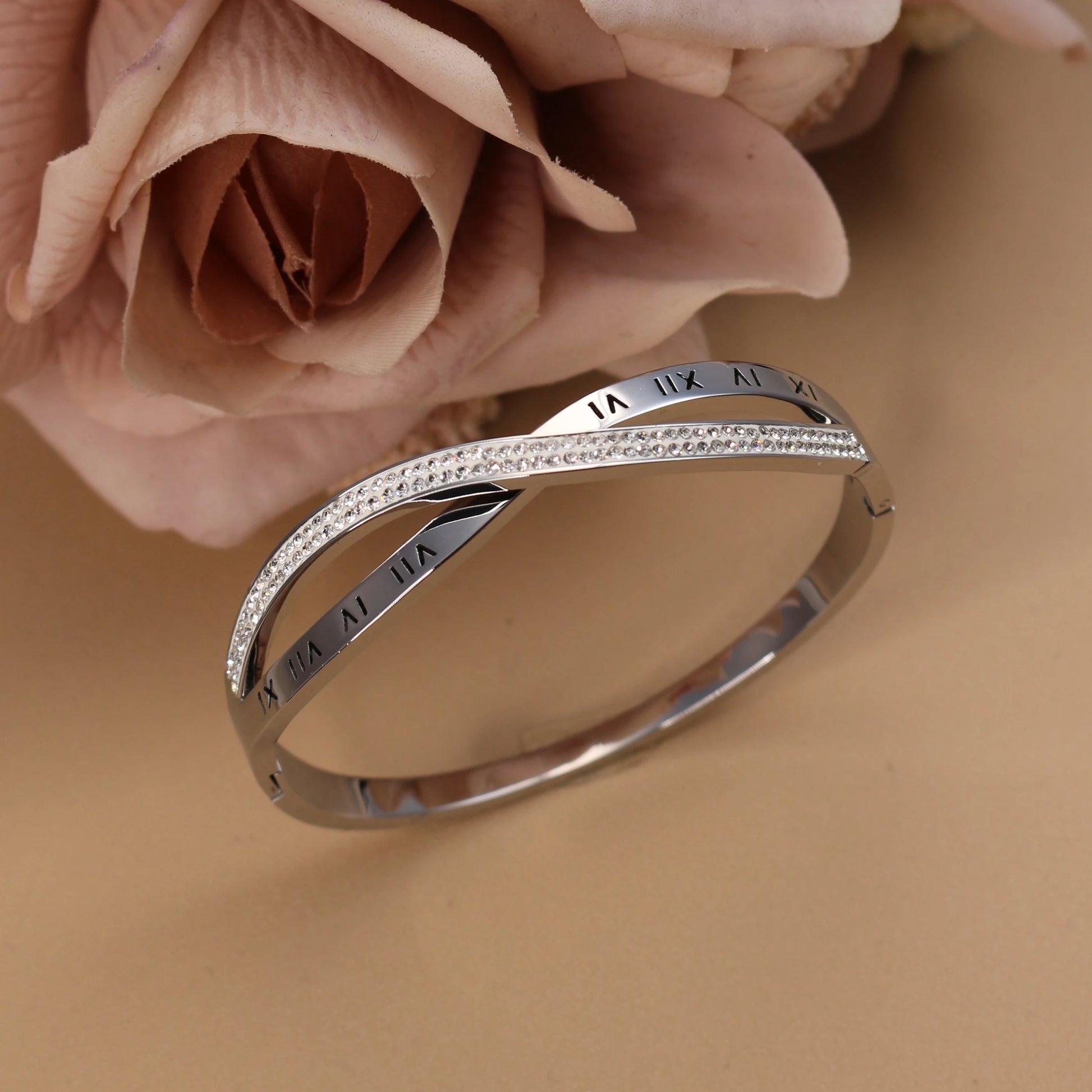 Woman wearing silver crystal bangle bracelet with elegant outfit