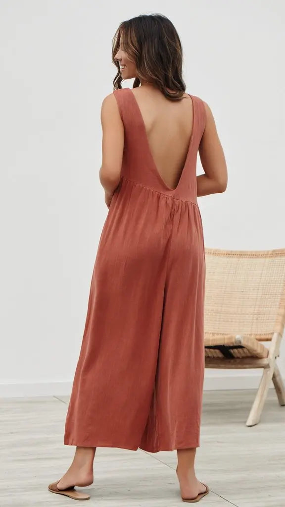 Rust-colored jumpsuit styled for casual outings.