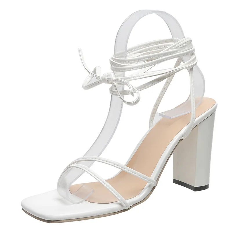 White dressy heels with adjustable ankle strap and 4-inch block heel