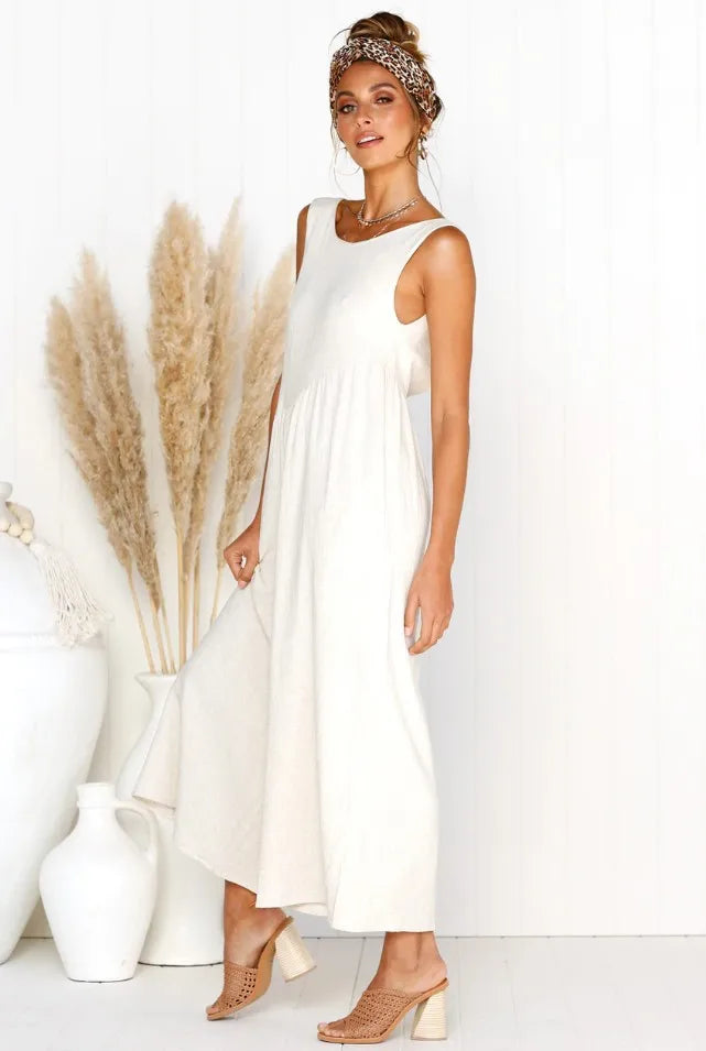 Modest white jumpsuit with a wide-leg fit.