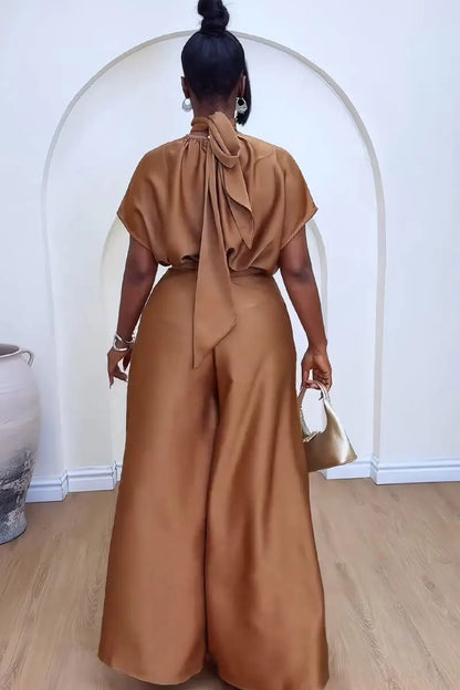 "Camel colored women's pantsuit back view showing flowing wide-leg silhouette and belt detail"