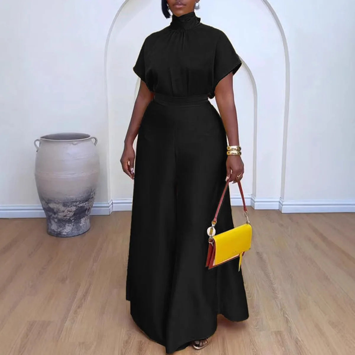 "Mock neck top front view highlighting modest neckline and short sleeve design"