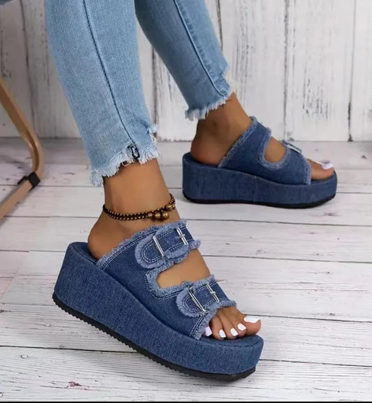 Fashionable summer sandals featuring frayed denim accents.