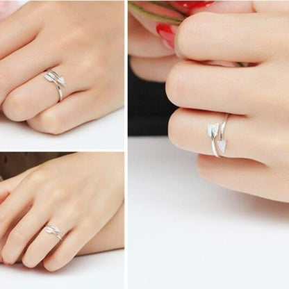 Women's arrow ring styled on hand showing adjustable fit
