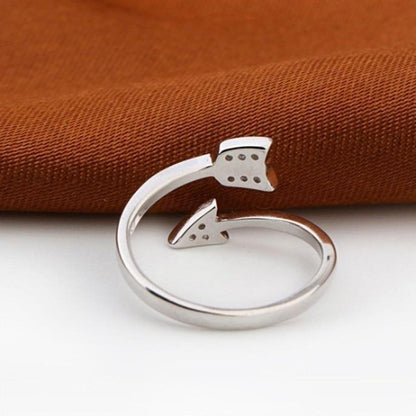 Crystal arrow ring showing symbolic design and adjustable band